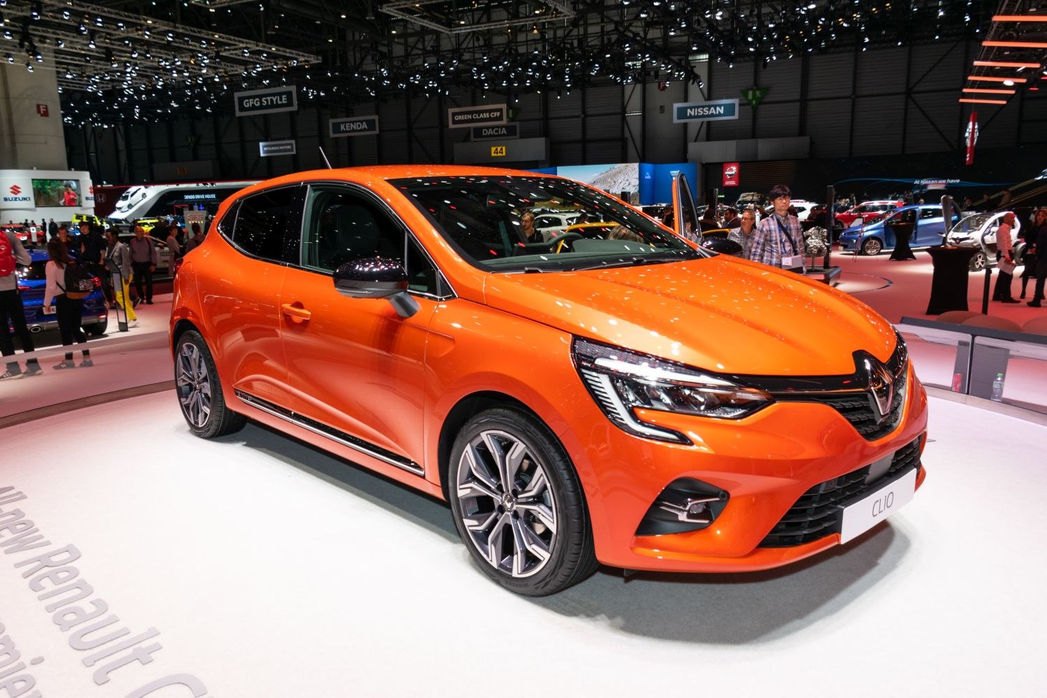 Sporty hatchback front and side with LED headlights in vibrant orange