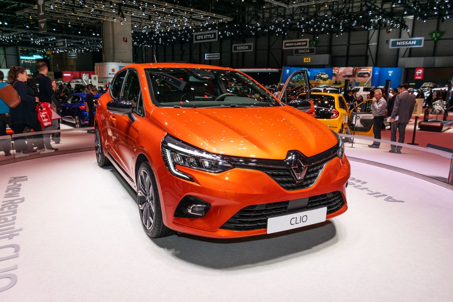 Orange modern hatchback front view with sleek headlights