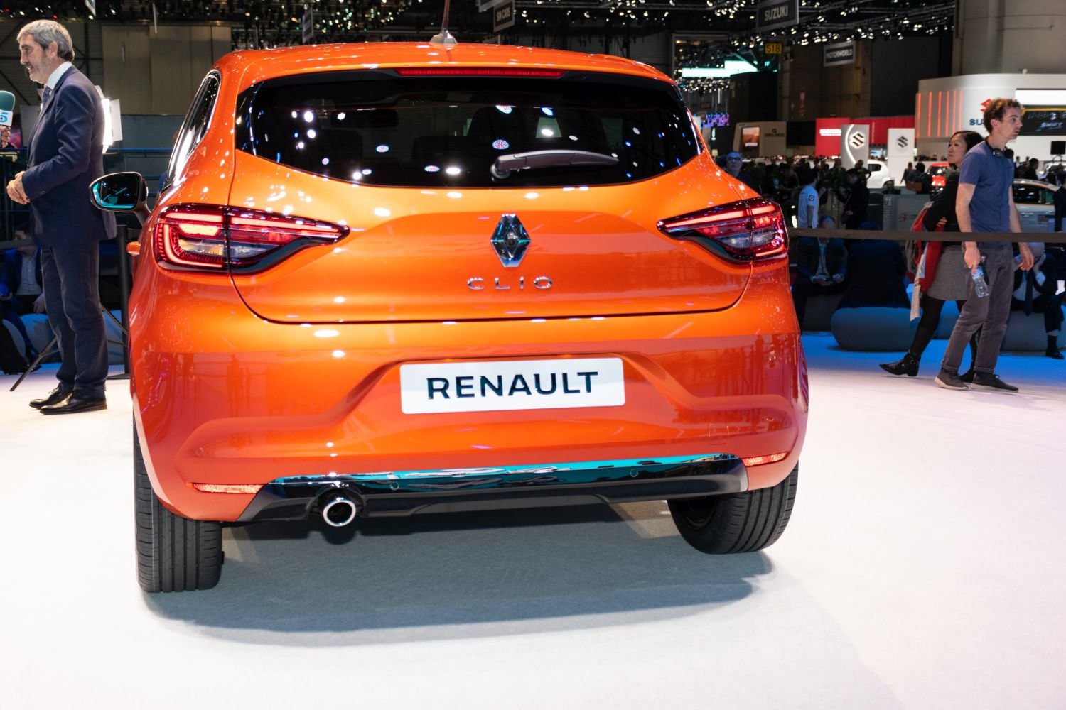 Orange hatchback rear with distinct tail lights and exhaust pipe