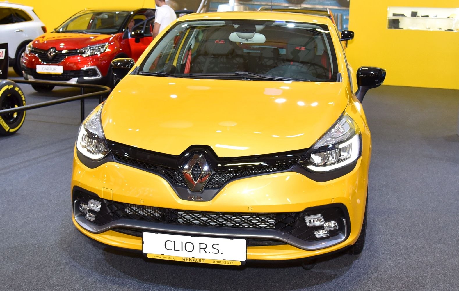 Front view with sporty headlights and grille in yellow