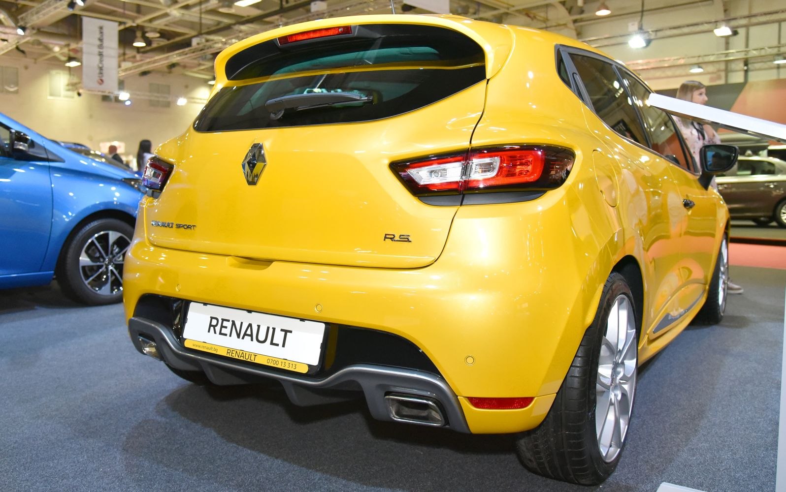 Rear view of a sporty hatchback with dual exhausts and modern tail lights