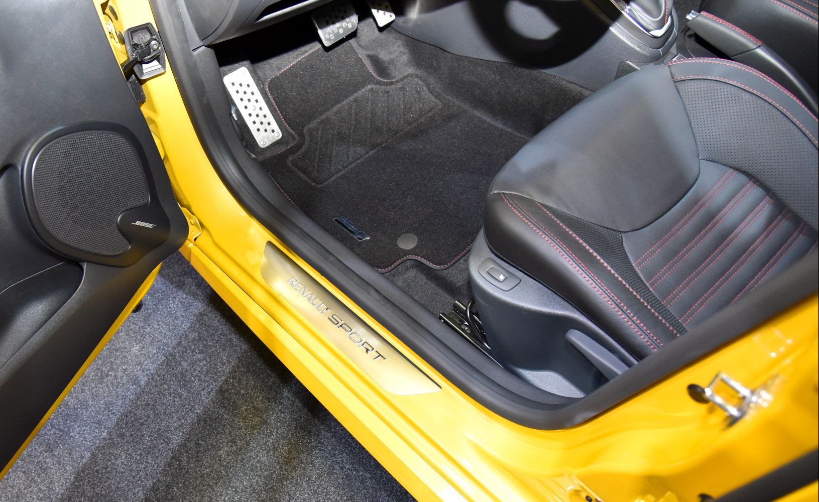 Sporty car door sill with Renault Sport logo and detailed driver's seat