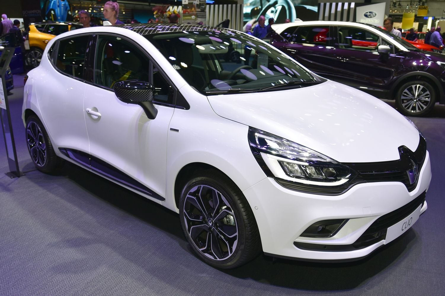 White hatchback front side with LED headlights and alloy wheels