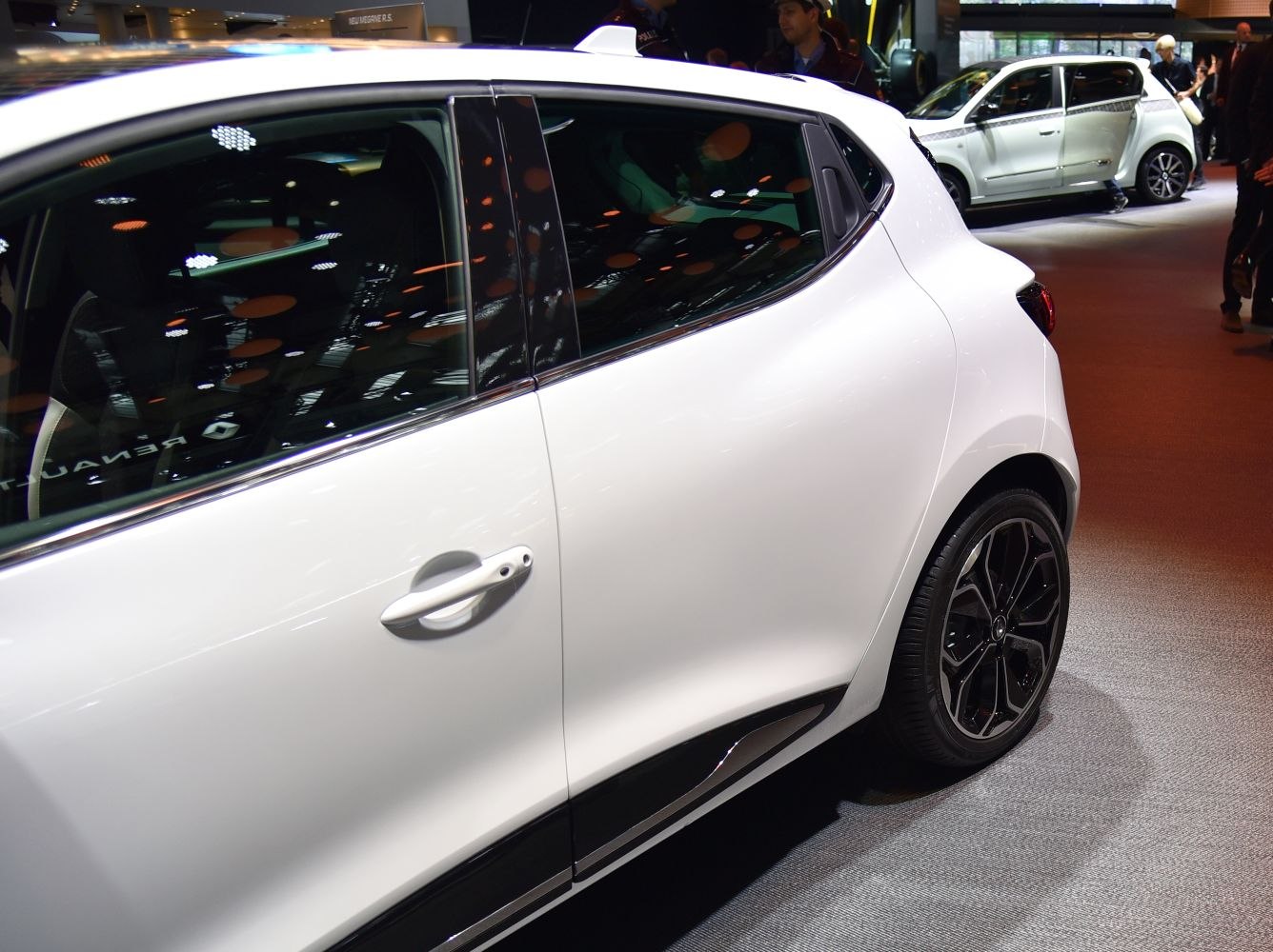 Side door, window trim, and rear wheel design of a compact hatchback