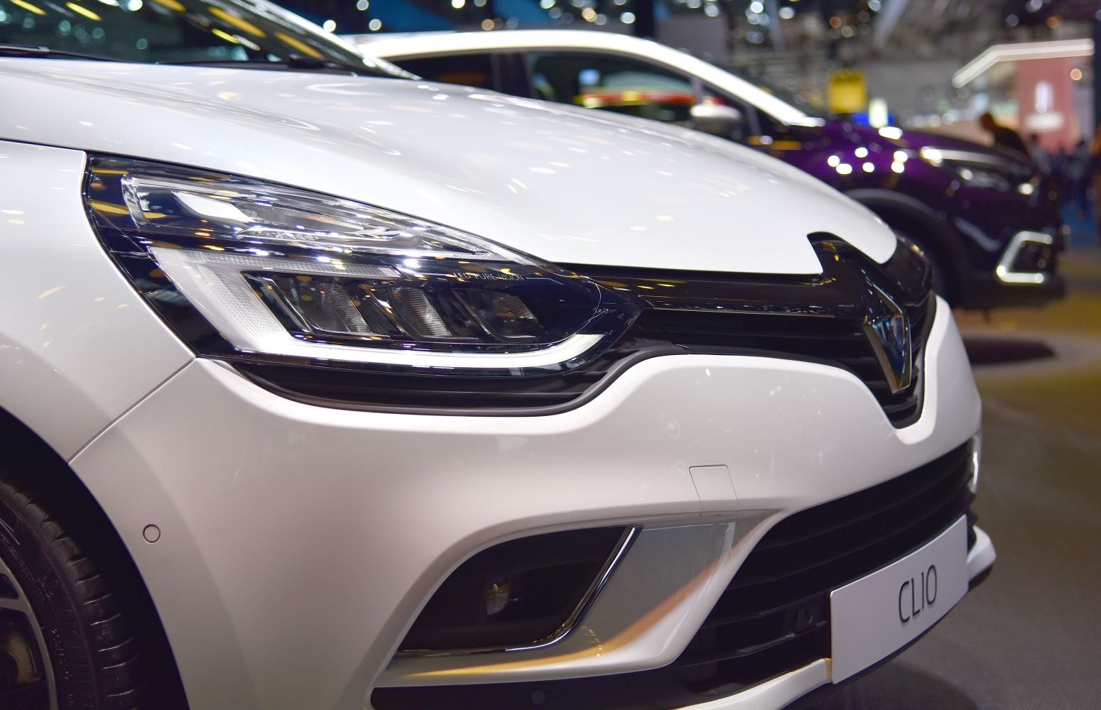 Close-up of front LED headlight and grille details