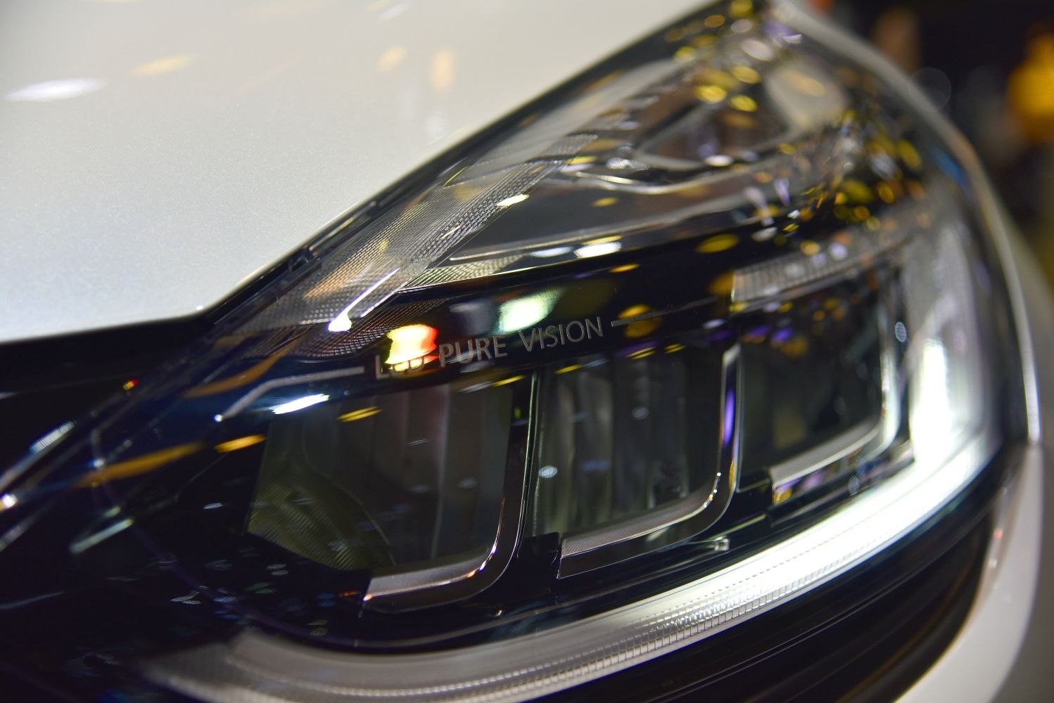Close-up of LED Pure Vision headlight with distinctive lens design