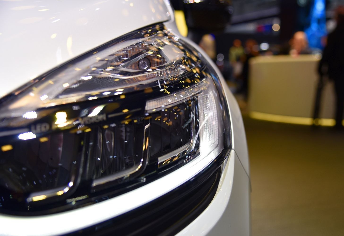 Close-up of modern LED headlight with intricate design.