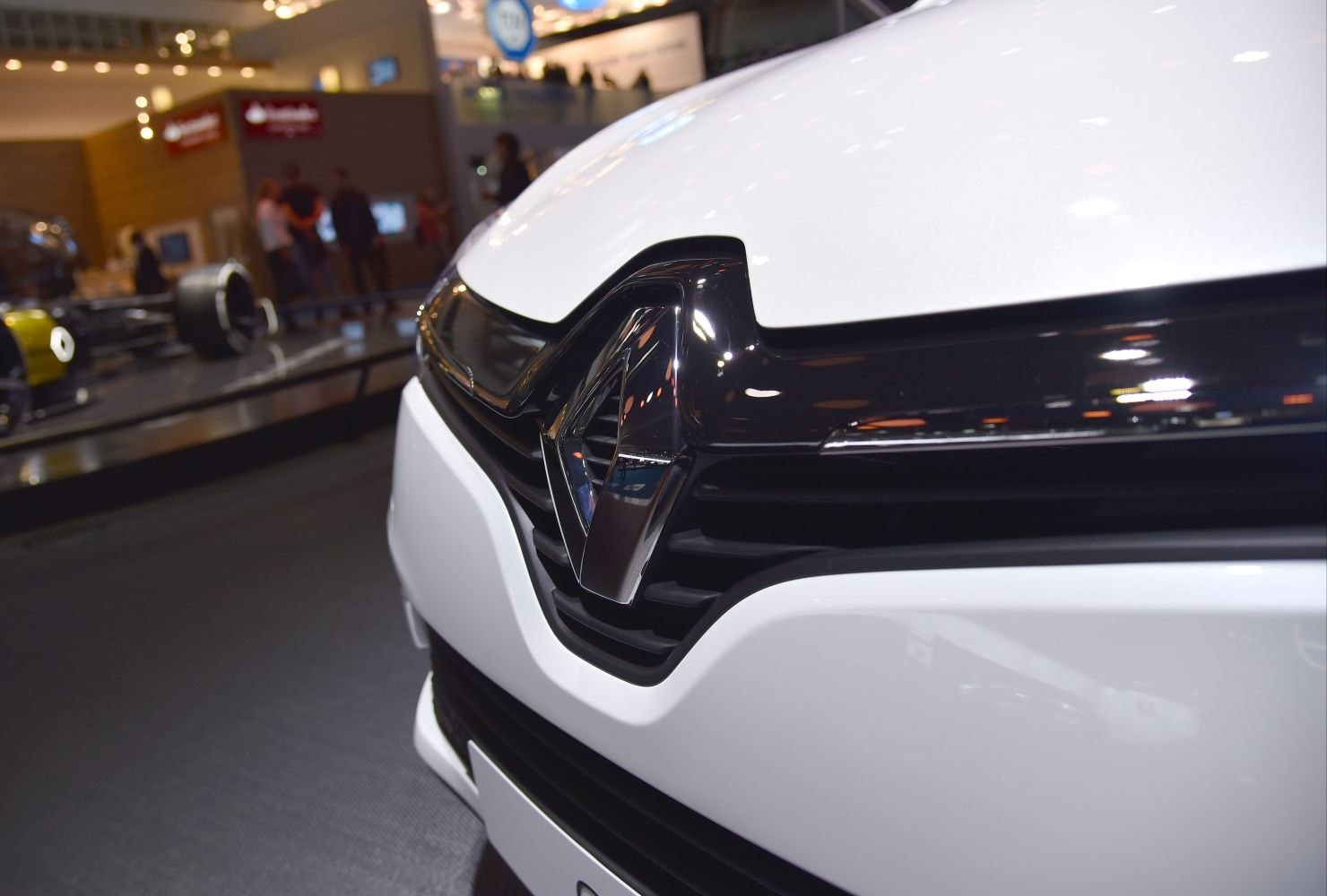 Close-up of front grille with prominent emblem and glossy black trim