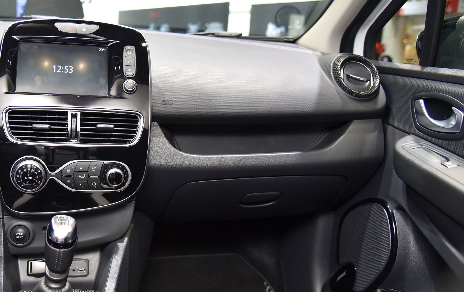Dashboard, center console, air vents, manual gear stick interior details