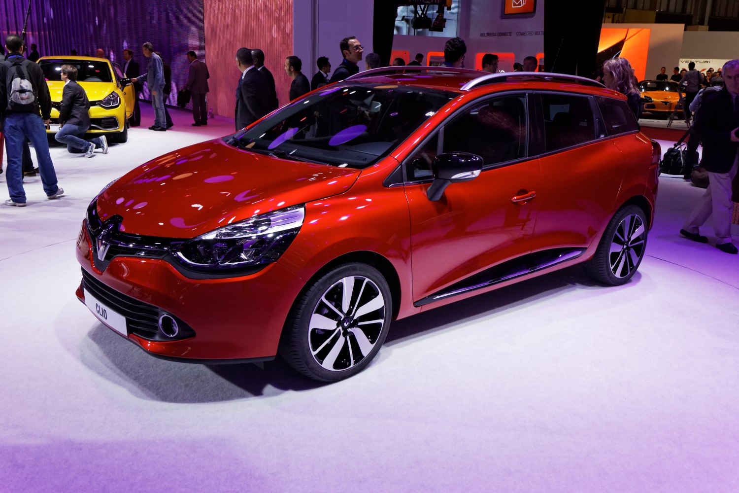Red compact station wagon with LED headlights and alloy wheels