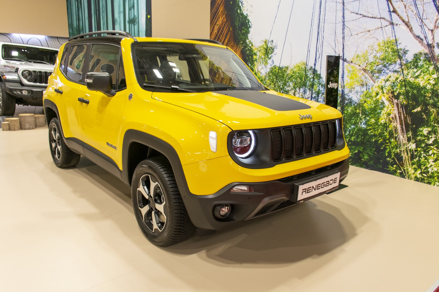 Yellow compact SUV with black grille and round LED headlights