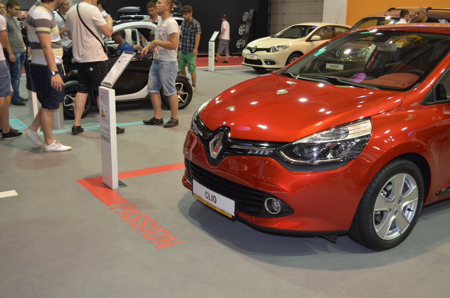 Red hatchback front with detailed headlights and grille