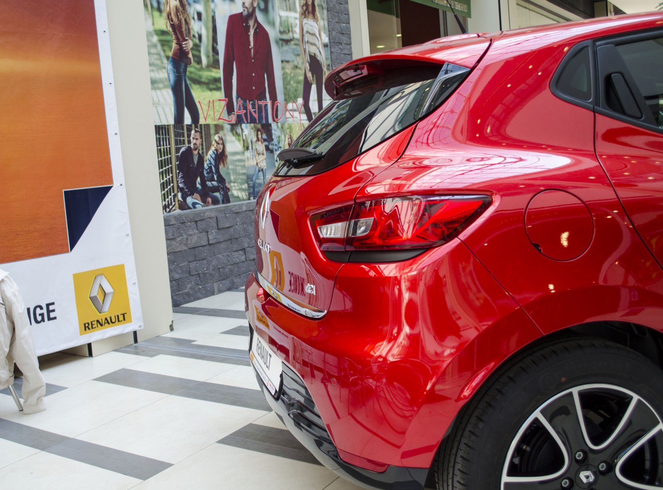 Red hatchback rear with distinctive taillight and fuel cap.