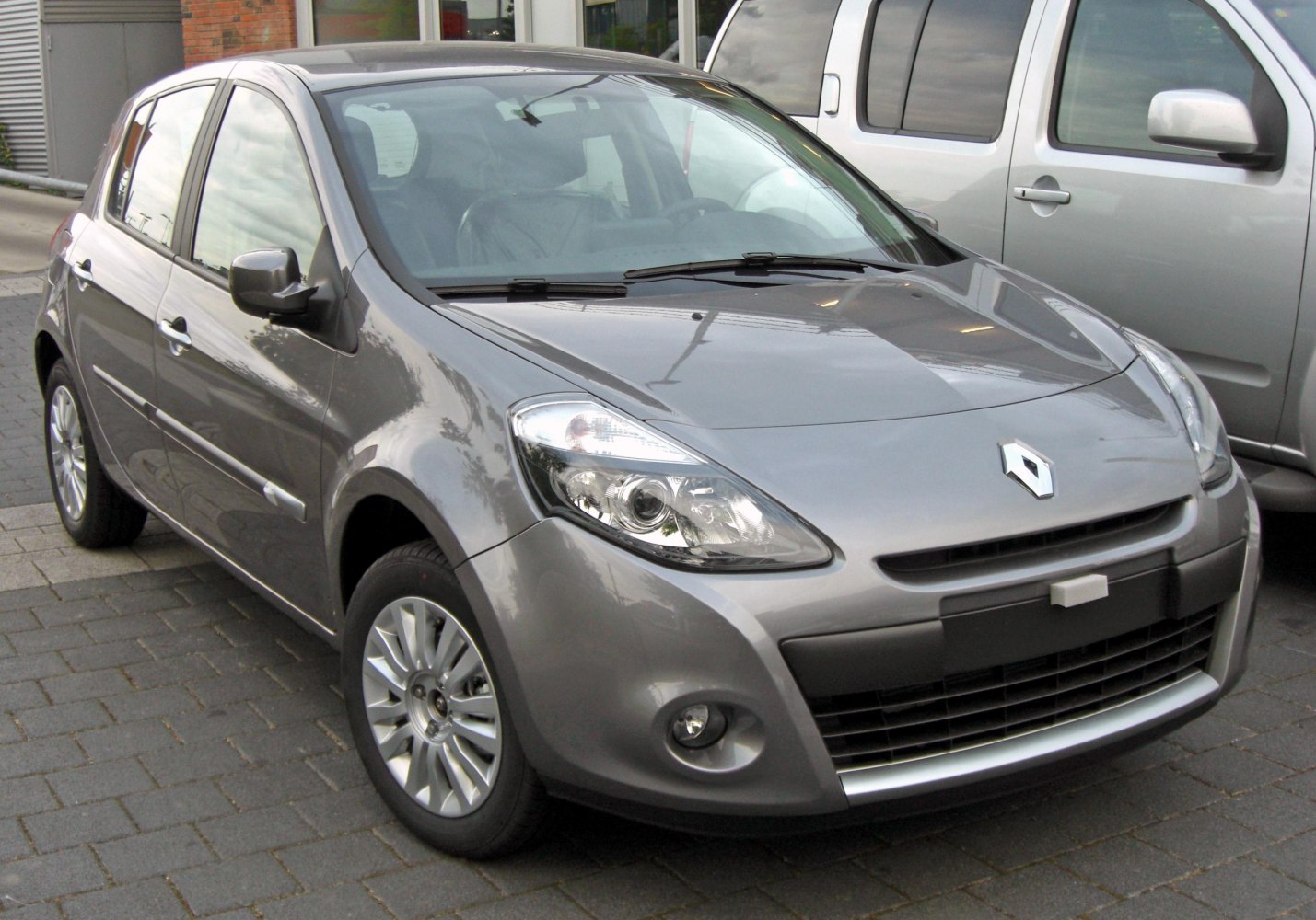 Front view with headlights, grille, and alloy wheels