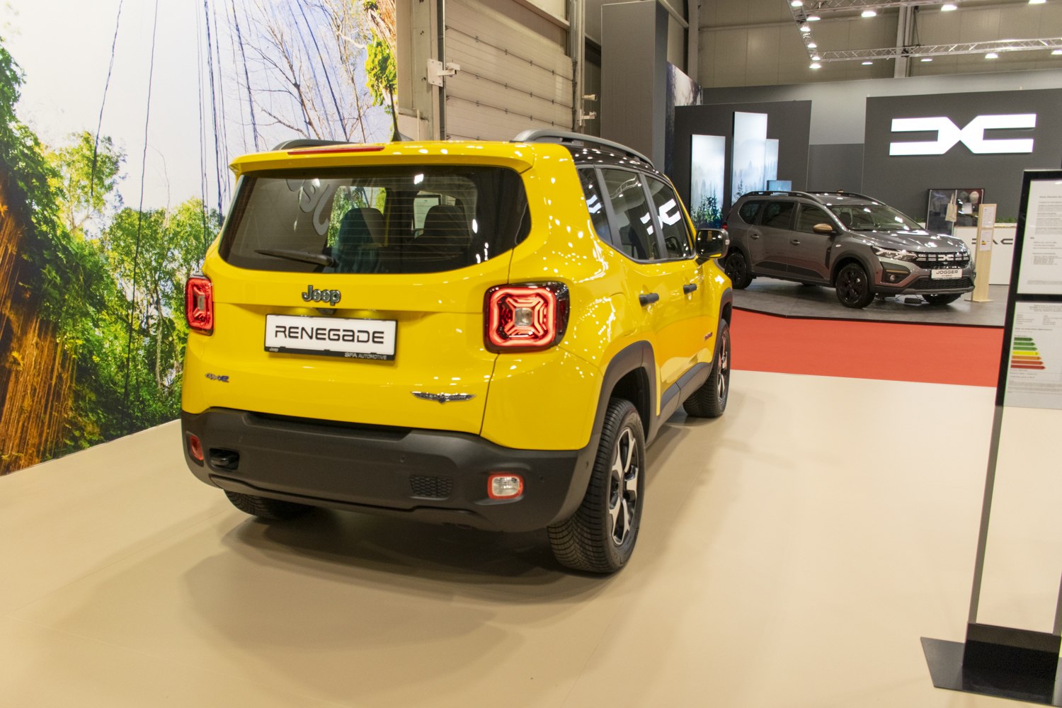 Rear view of a yellow SUV with distinct square LED taillights and rugged design