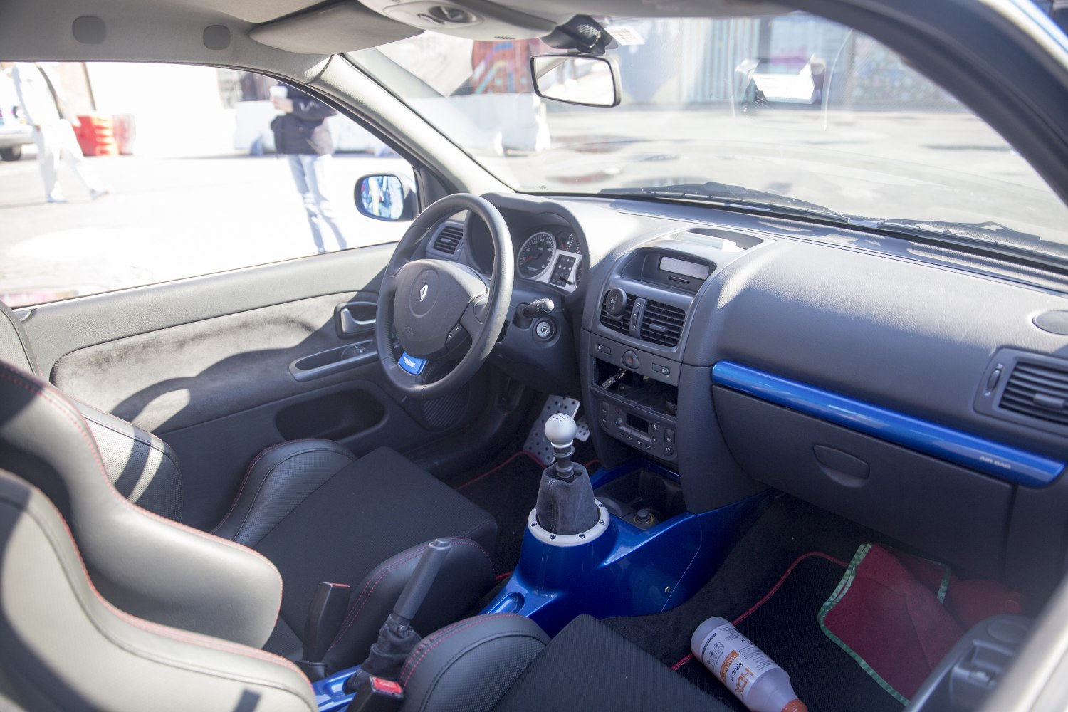 Dashboard and manual gear shifter in car interior