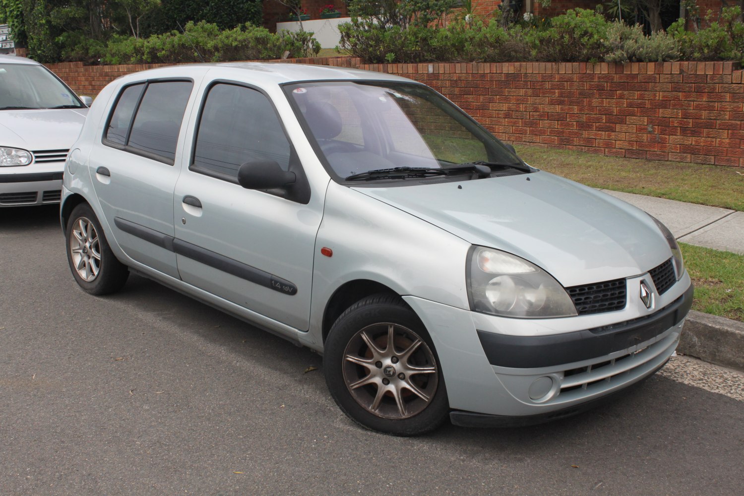 Silver 5-door hatchback with alloy wheels and front detailing