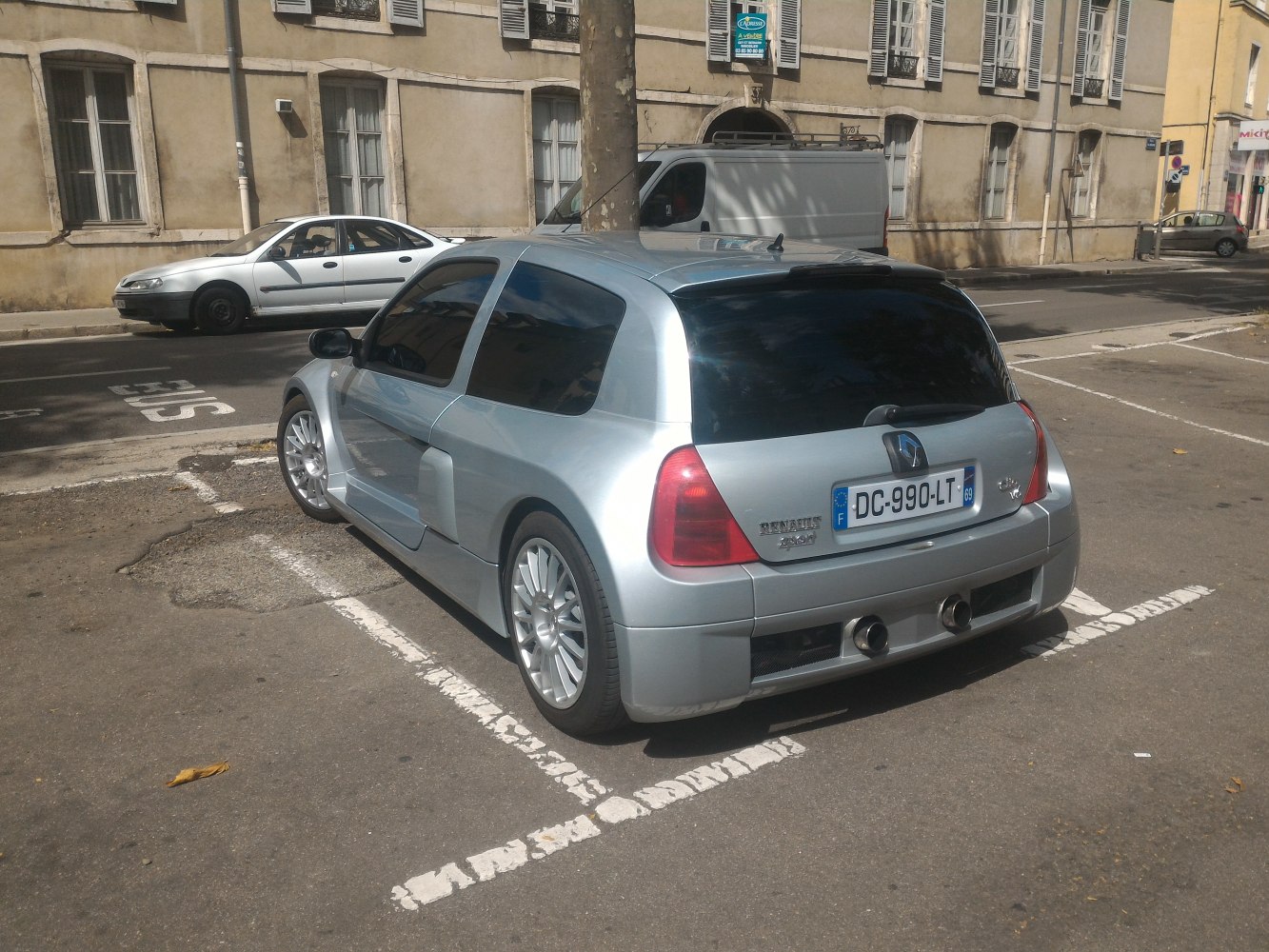 Rear view of sporty hatchback with dual exhaust and wide fenders