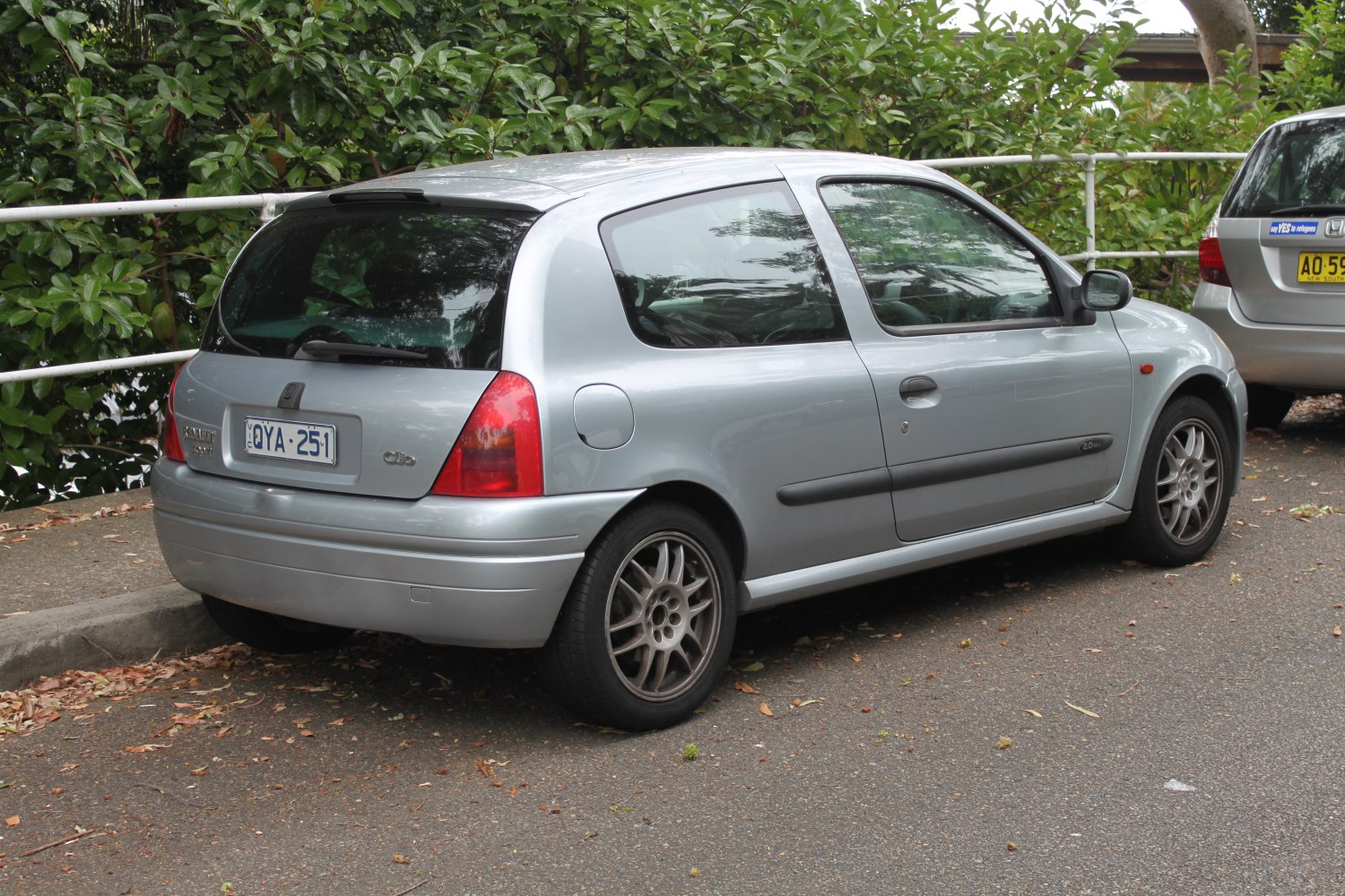 Rear and side profile of silver 3-door hatchback with alloy wheels and rear spoiler