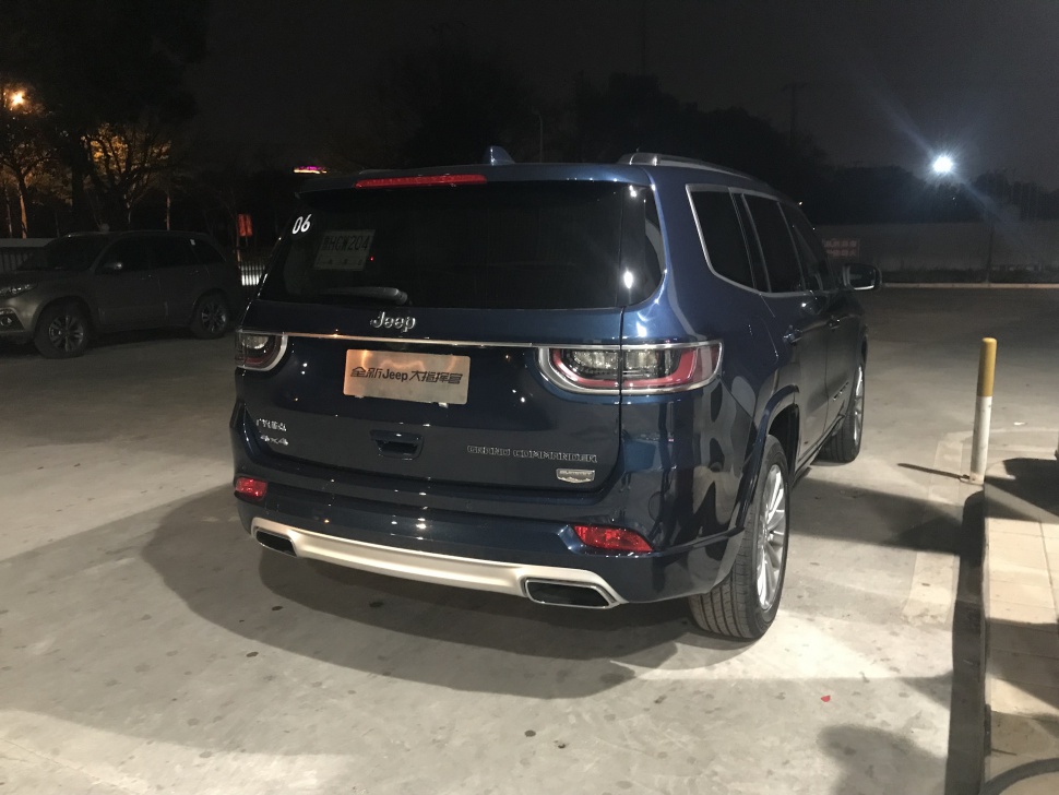 Night view of rear side with taillights and dual exhaust