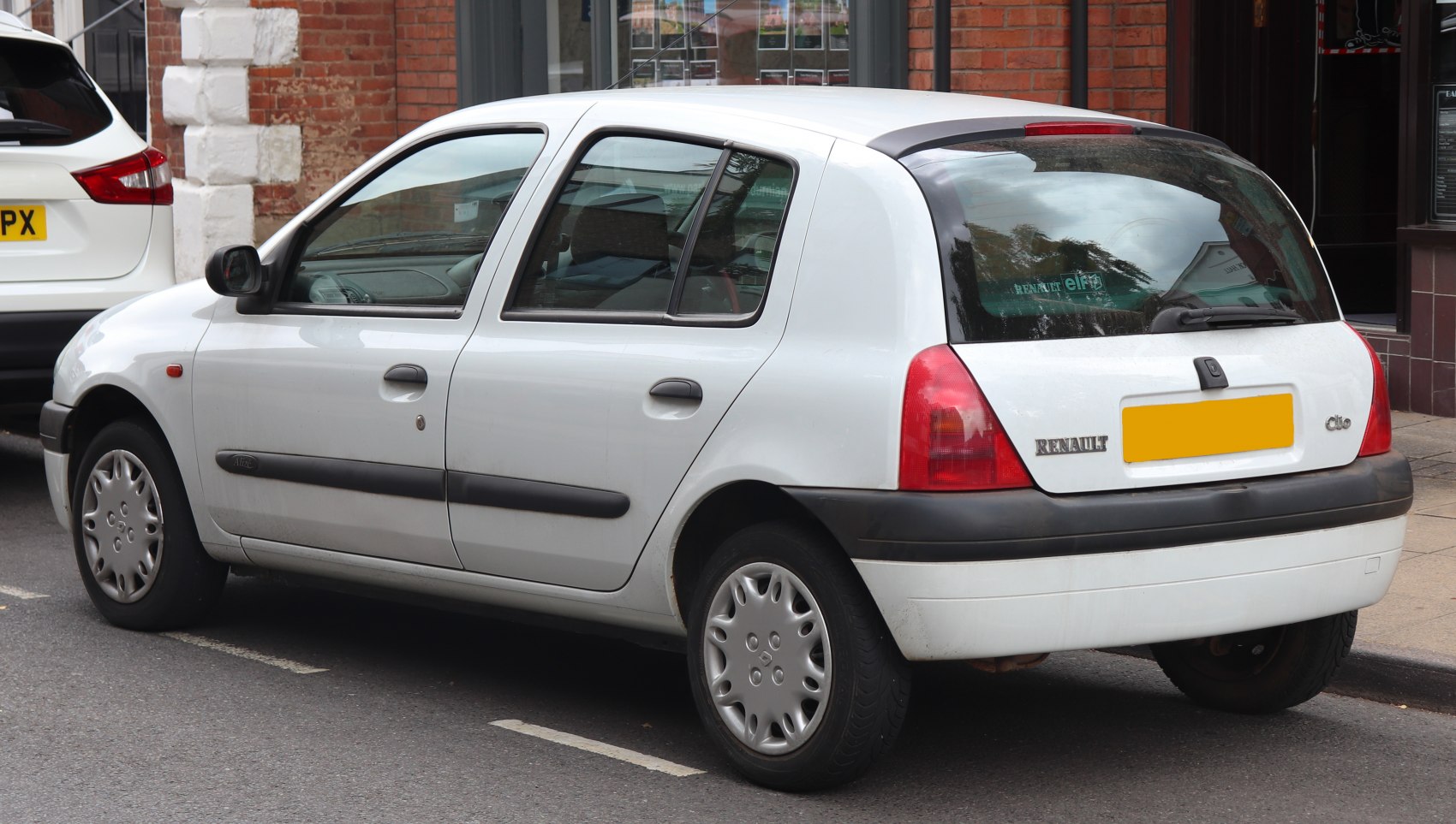 Rear side of a 5-door hatchback with black bumper and wheel covers
