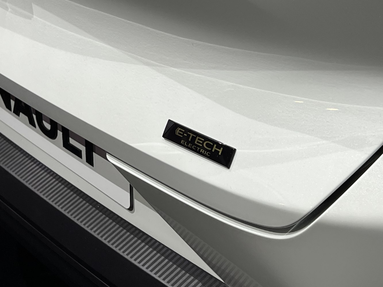 Close-up of E-Tech Electric badge and part of rear end.