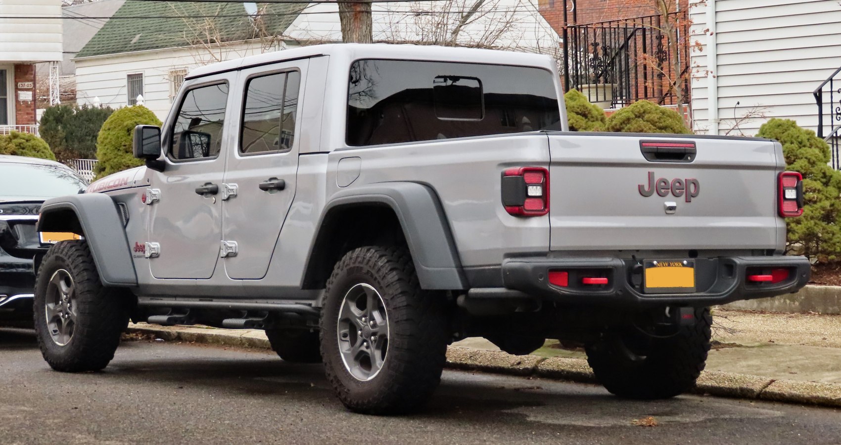 Rear side view of pickup with crew cab and off-road tires