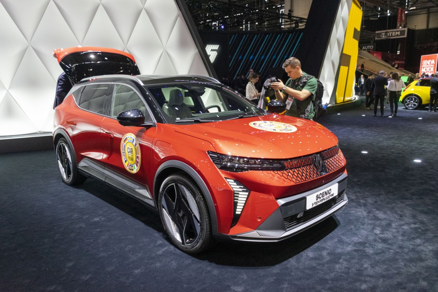 Front view of a futuristic electric SUV with open tailgate