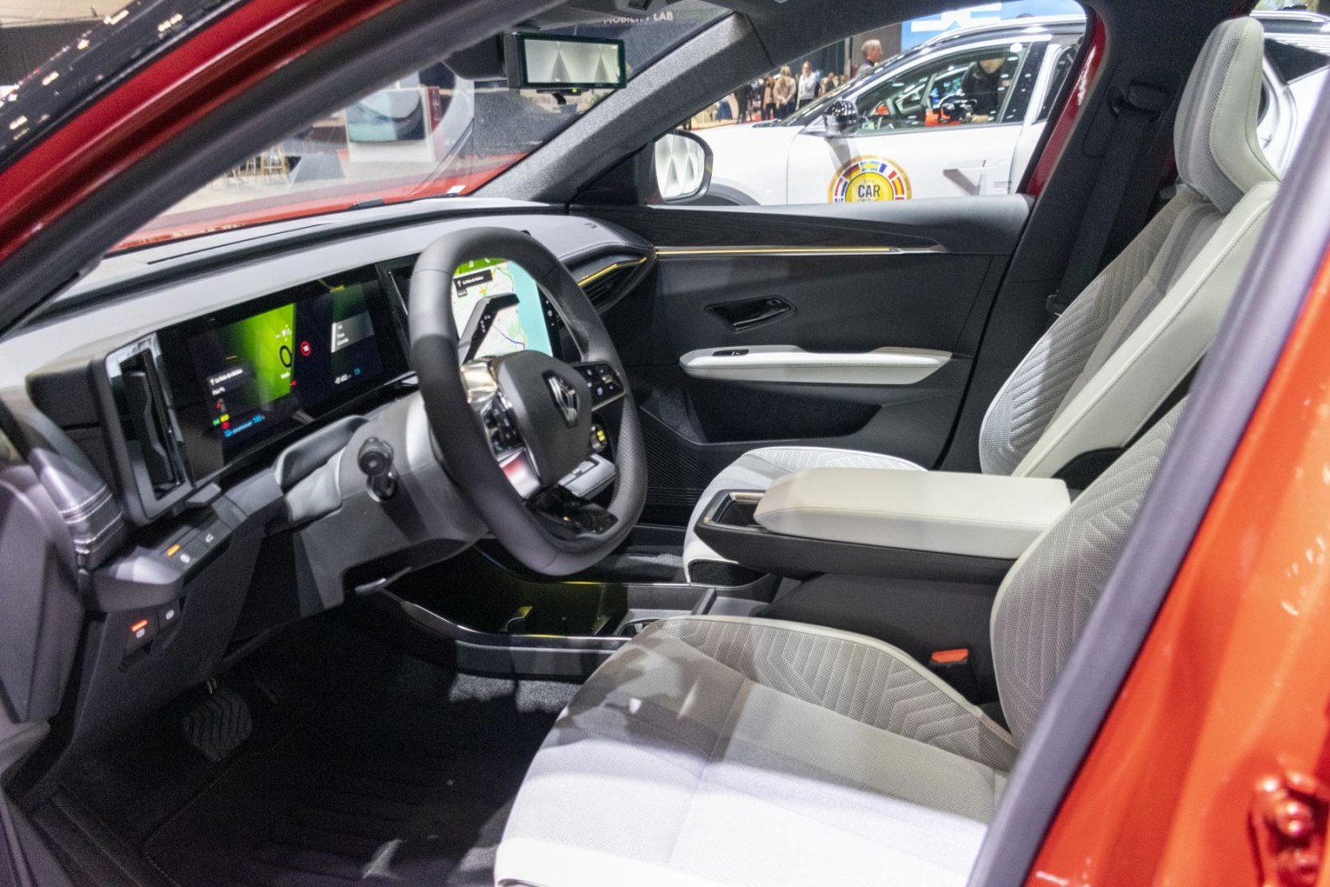 Modern car interior with digital dashboard and touchscreen infotainment.