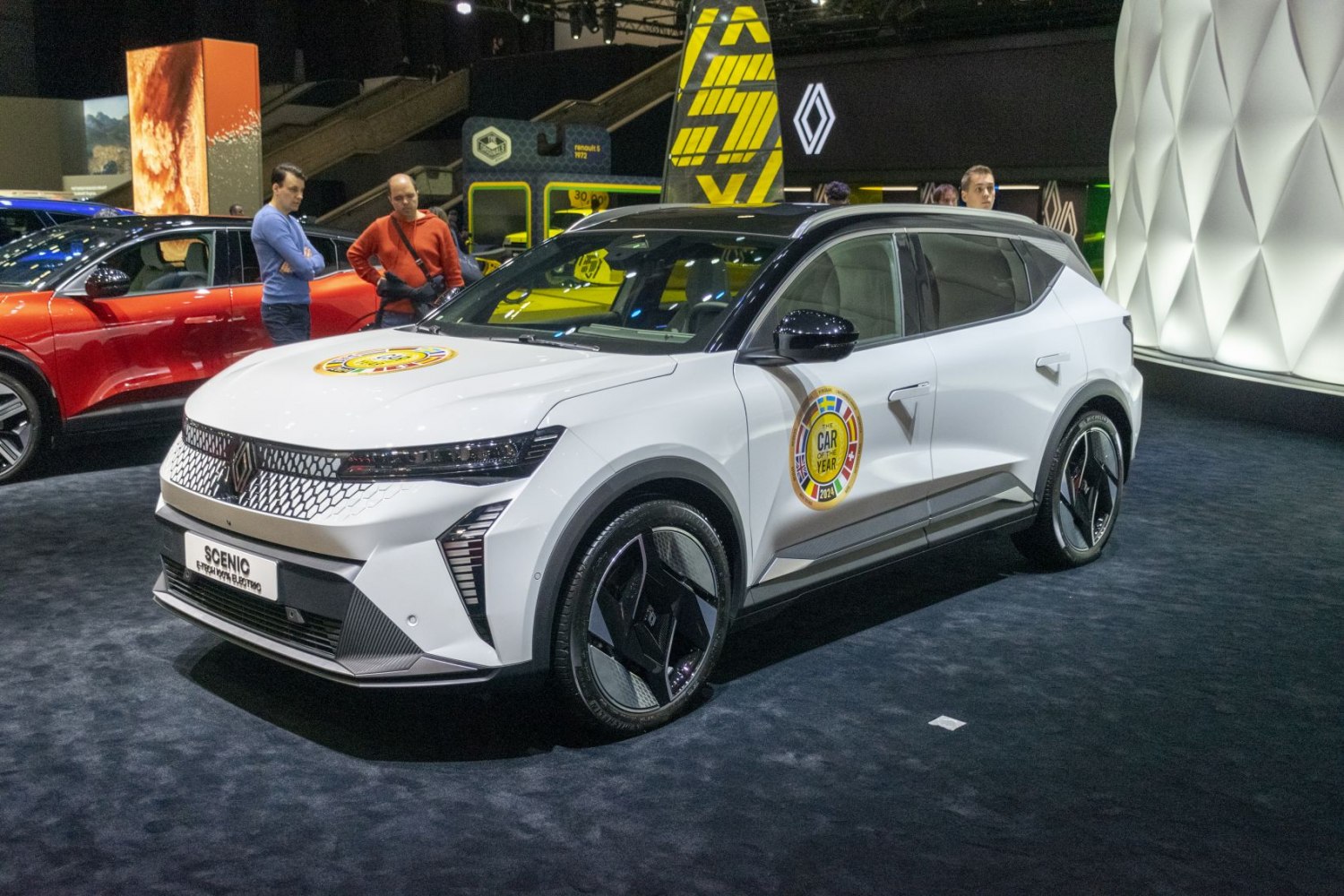 Modern electric SUV with sleek LED headlights and futuristic front grille.