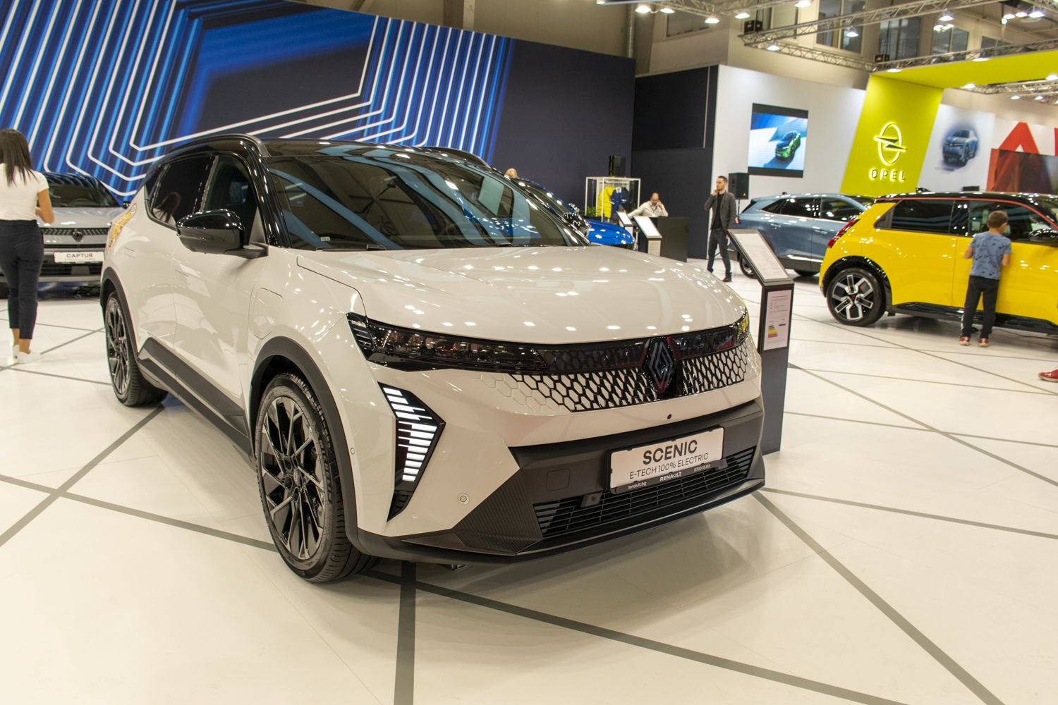 Modern front and side view with LED daytime running lights and honeycomb grille.