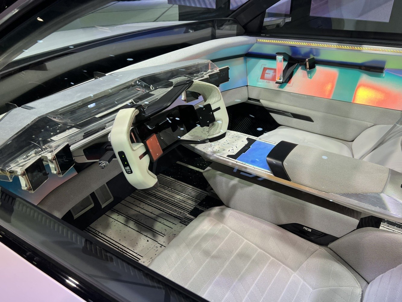 Futuristic interior with yoke steering wheel and digital dashboard