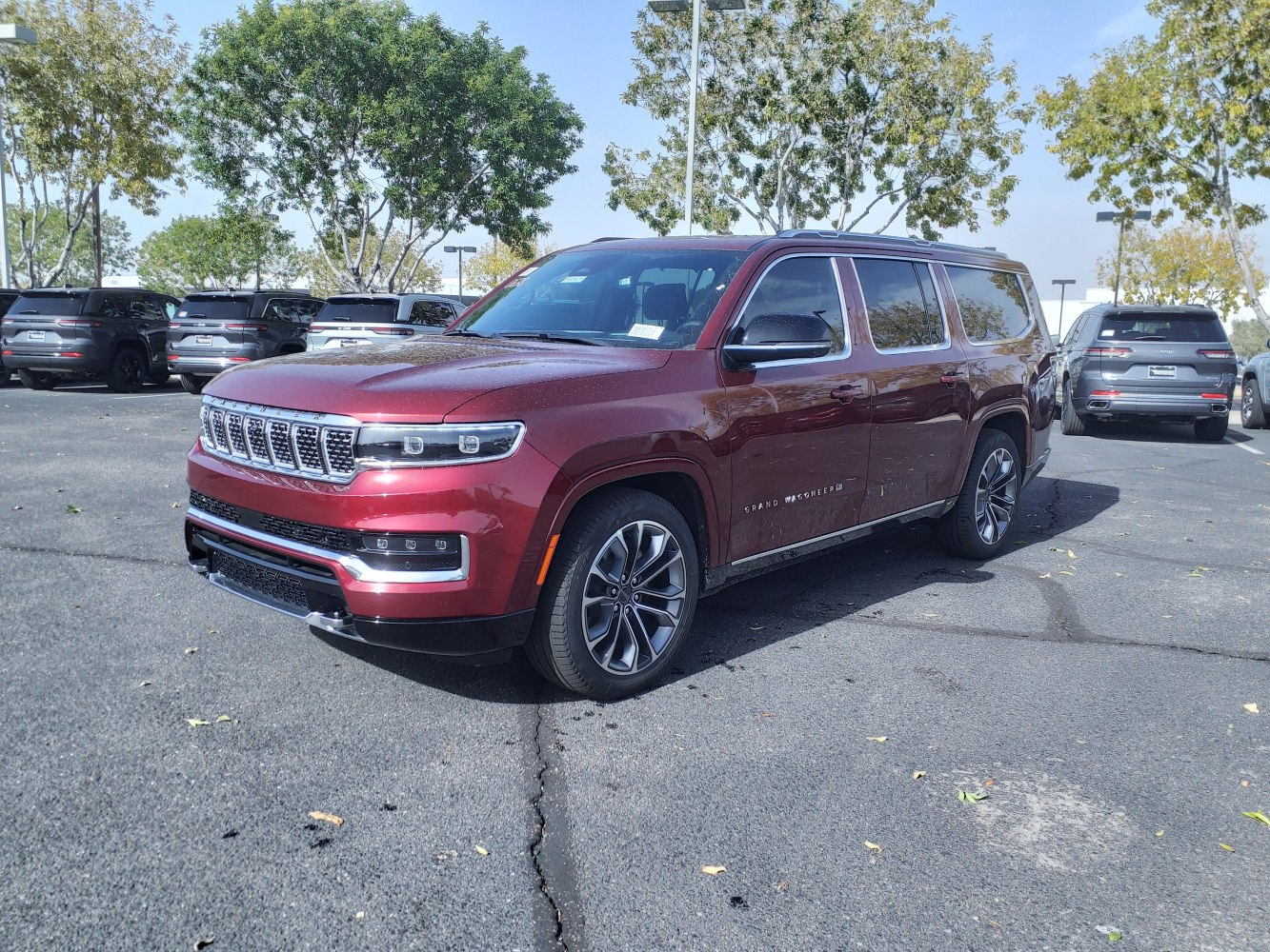 Bold front grille and sleek side profile of a large luxury SUV