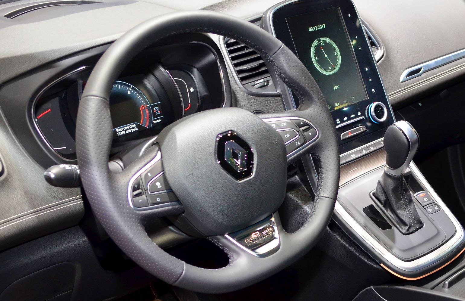 Steering wheel and gear shift with digital dashboard and infotainment screen