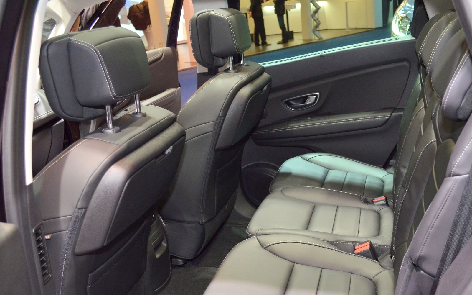 Spacious rear leather seats with headrests and detailed stitching