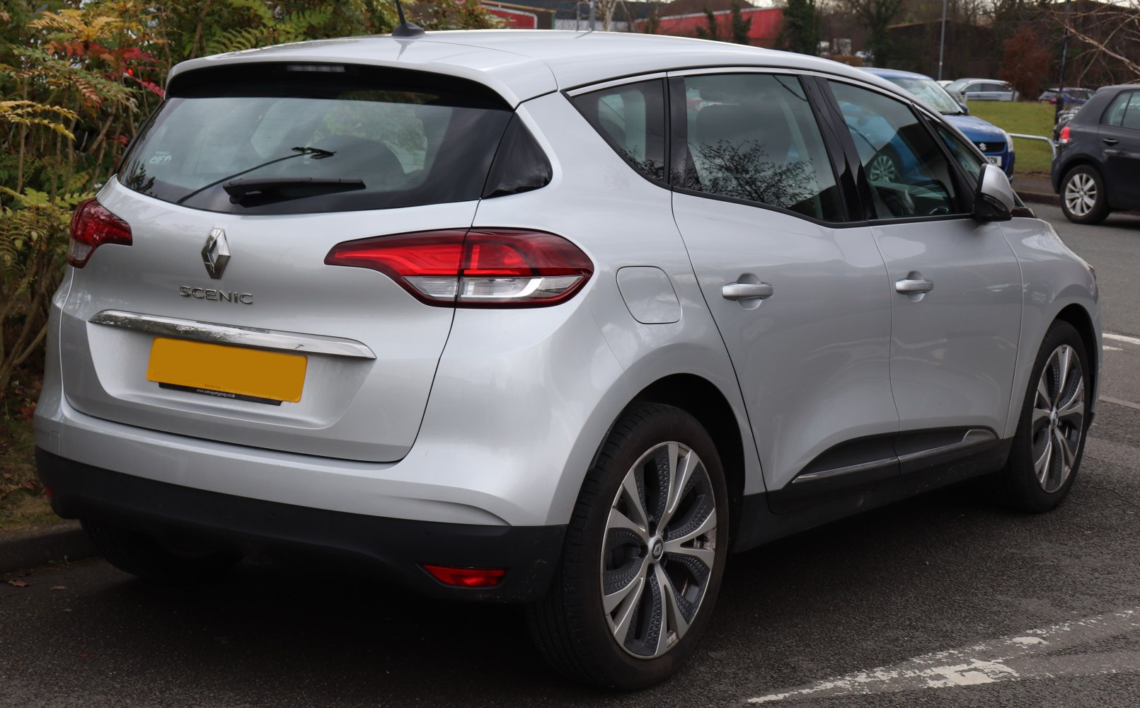 Rear view of silver vehicle with distinct taillights and alloy wheels