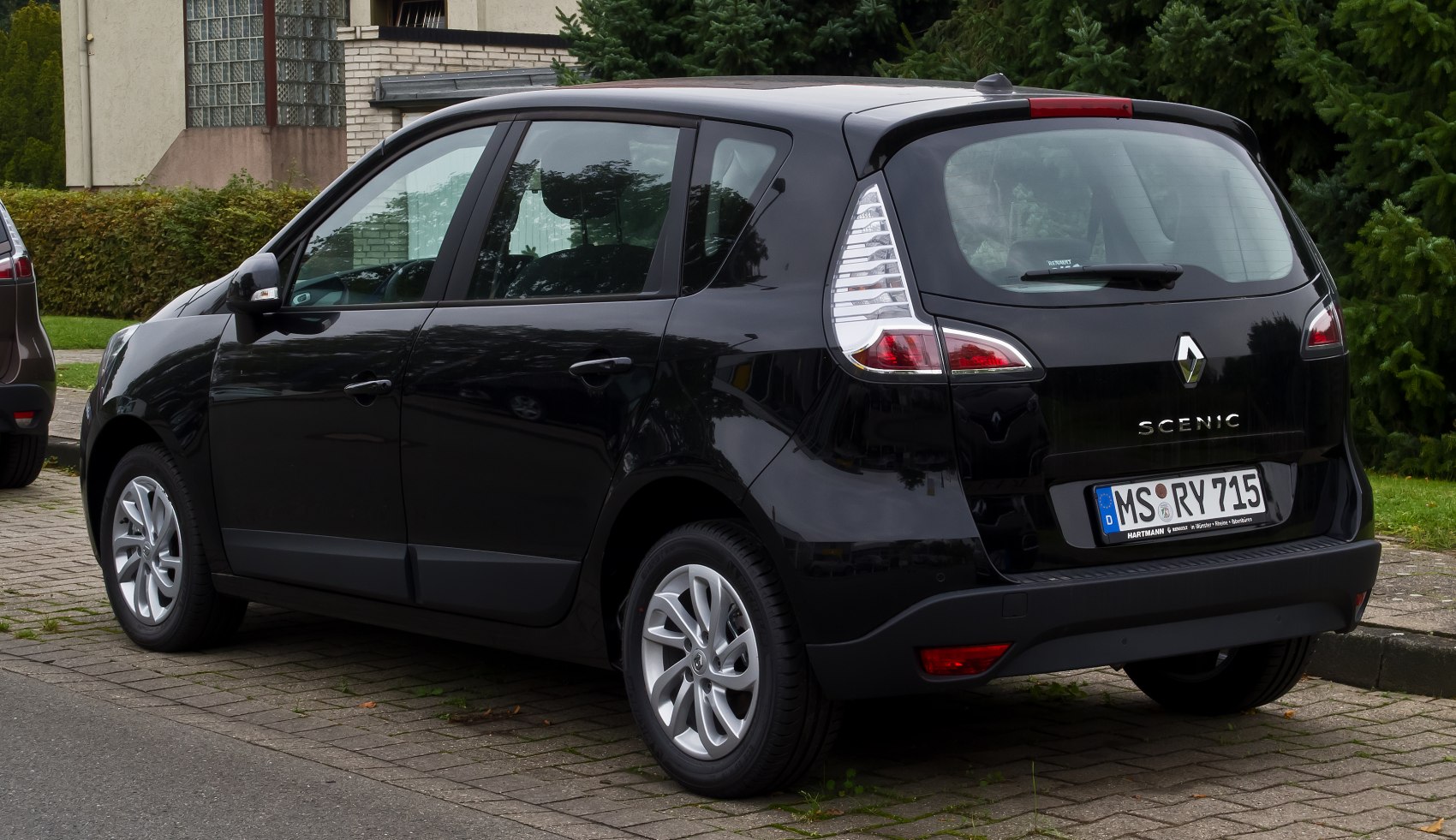 Rear view of a compact hatchback with distinct vertical taillights and alloy wheels