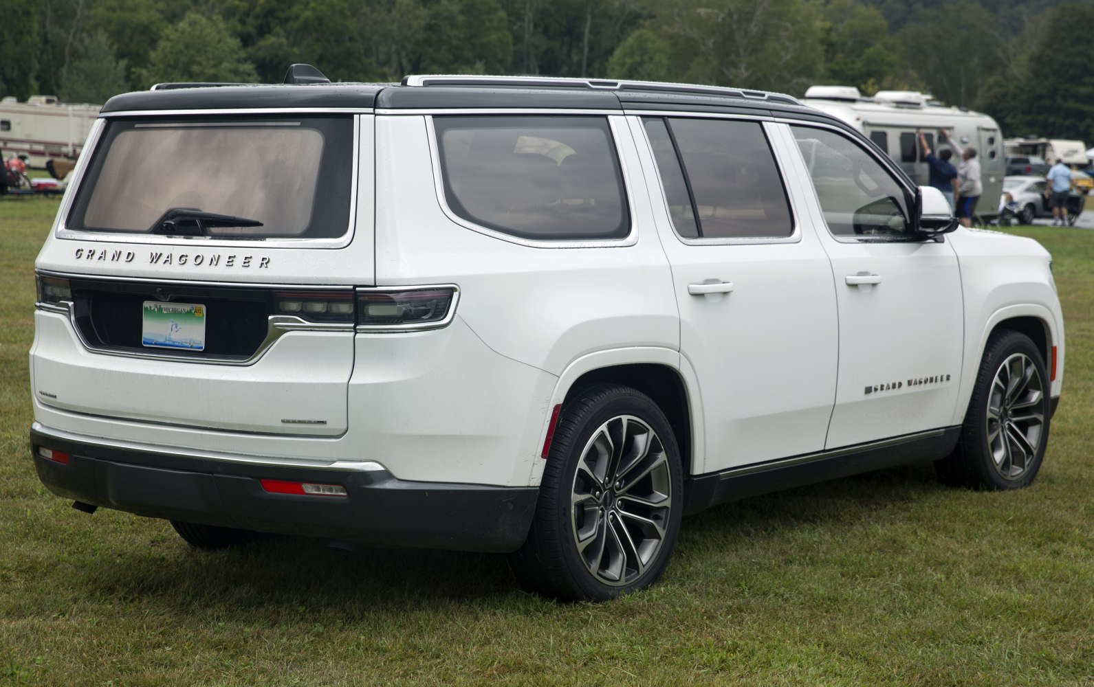 Rear side view of a white SUV with LED tail lights and alloy wheels