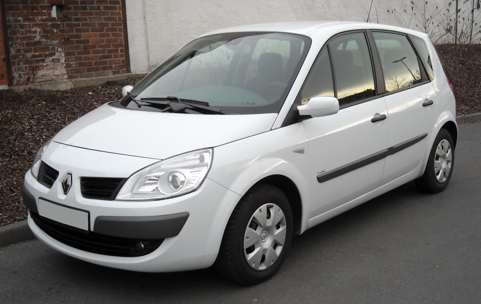 White compact MPV front-side perspective with detailed headlights and wheels