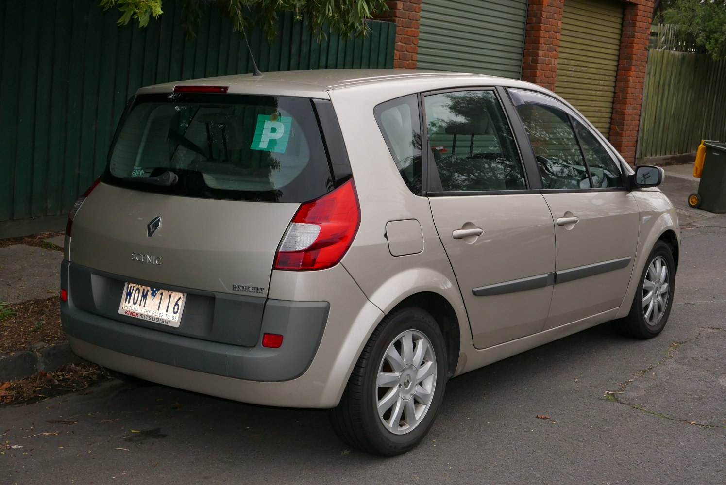 Rear side view of a compact MPV with distinctive taillights and rear hatch