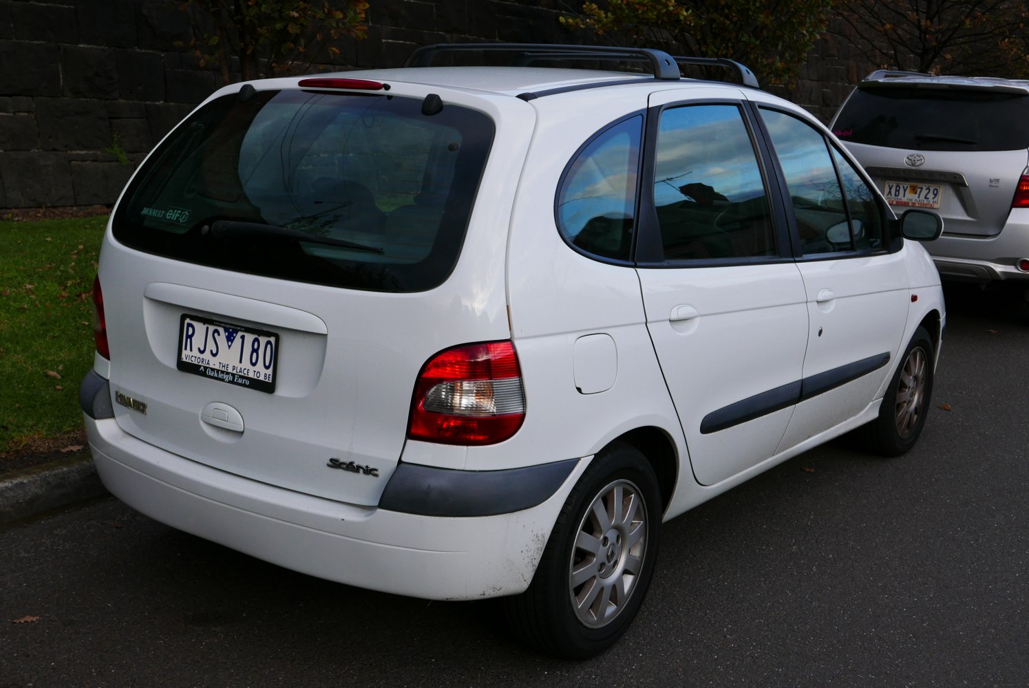 White compact hatchback rear with rounded window and tail lights