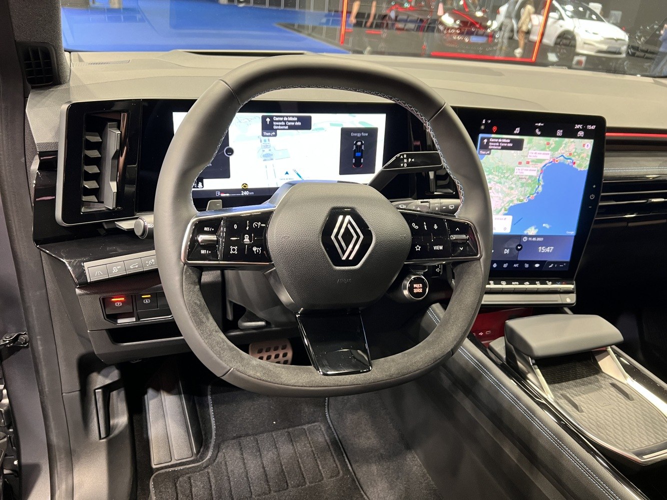 Digital dashboard with multifunction steering wheel and large navigation touchscreen