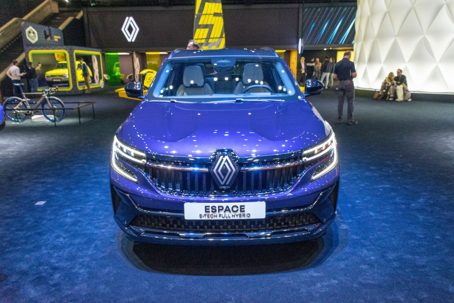 Front view of hybrid car with LED headlights and large grille