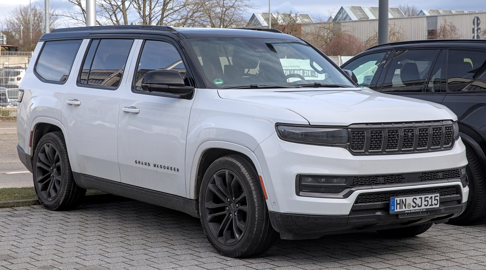 Front side view with LED headlights and black alloy wheels