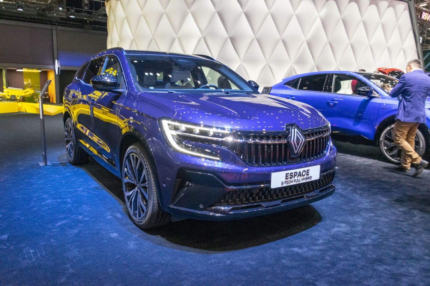 Blue SUV front angle with LED headlights and wide grille.