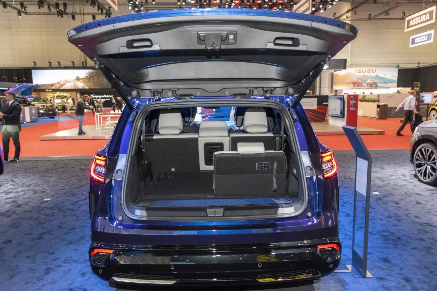 Rear cargo space with split folding seats and open hatchback liftgate.