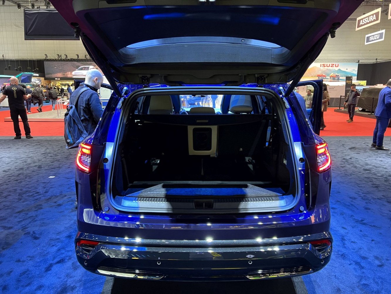 Open rear trunk and spacious cargo area with tailgate lifted