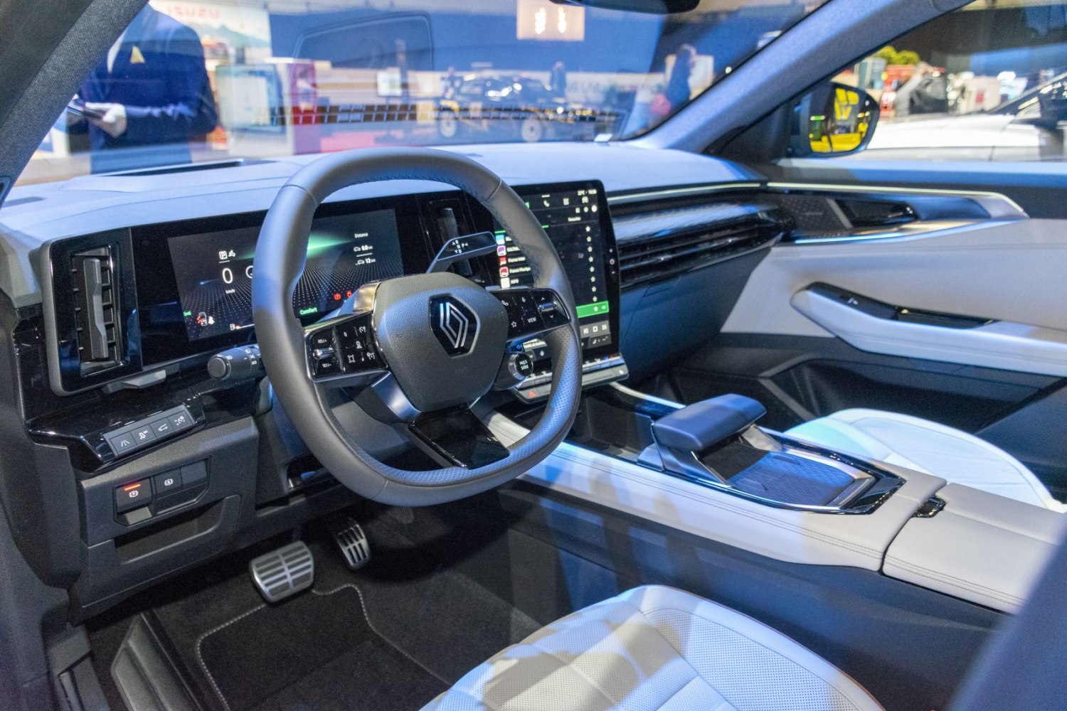 Digital instrument cluster and large infotainment touchscreen in premium car interior