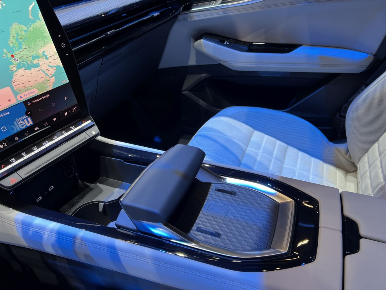 Digital touchscreen and modern center console with armrest and comfortable seating