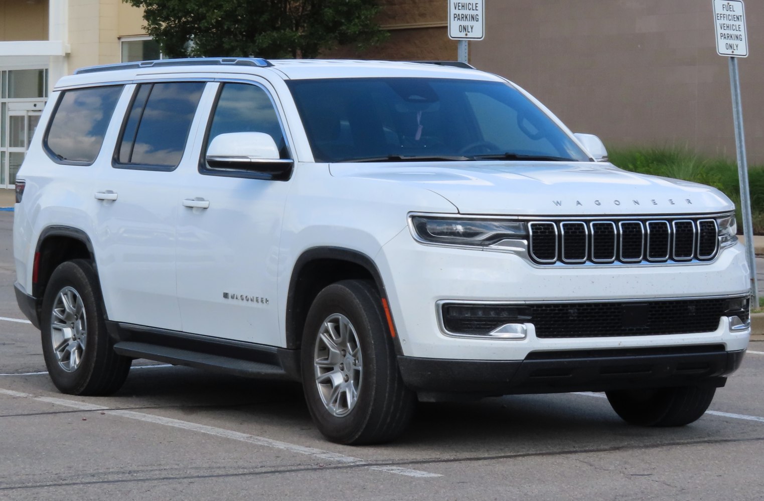 White SUV with distinctive grille and roof rails